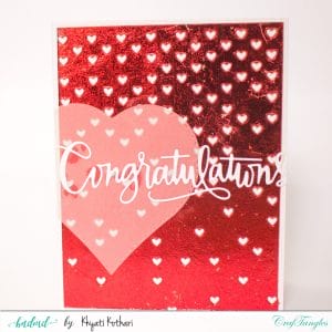 Red foiled Congratulations handmade card with falling hearts